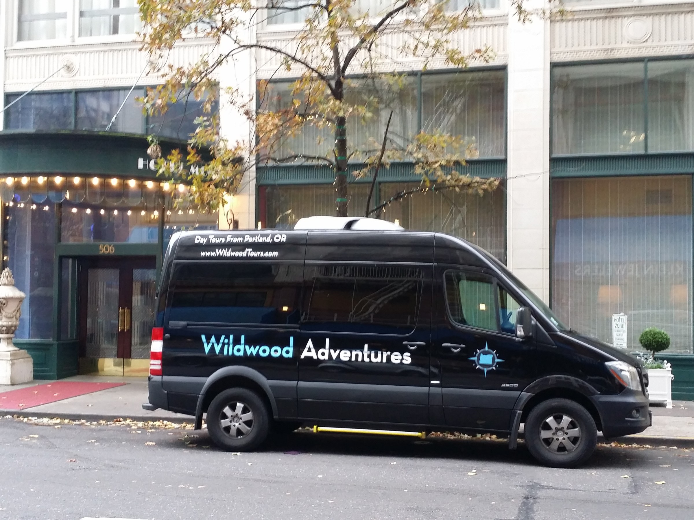 Wildwood Adventures tour vehicle picking up tour customers in downtown Portland