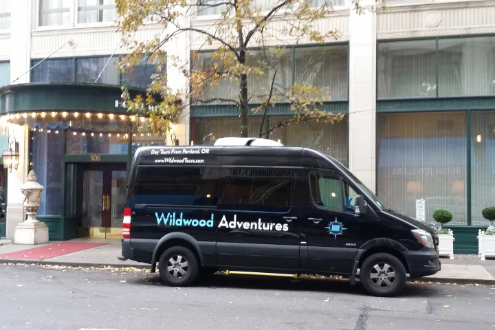 Wildwood Adventures tour vehicle picking up tour customers in downtown Portland