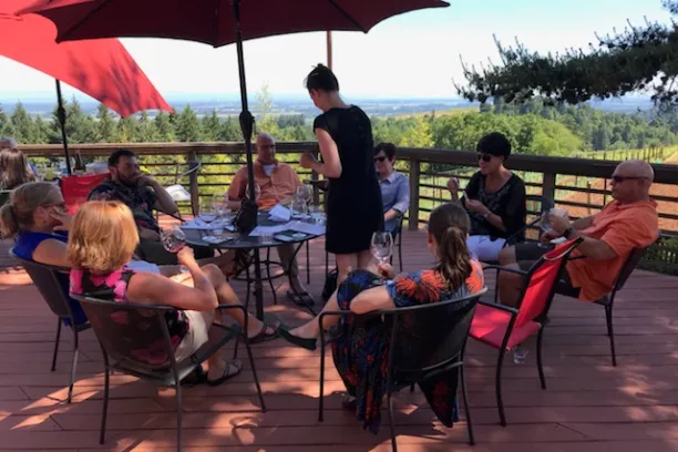 Wine tasting in the sunshine during Willamette Valley Wine Tasting Tour