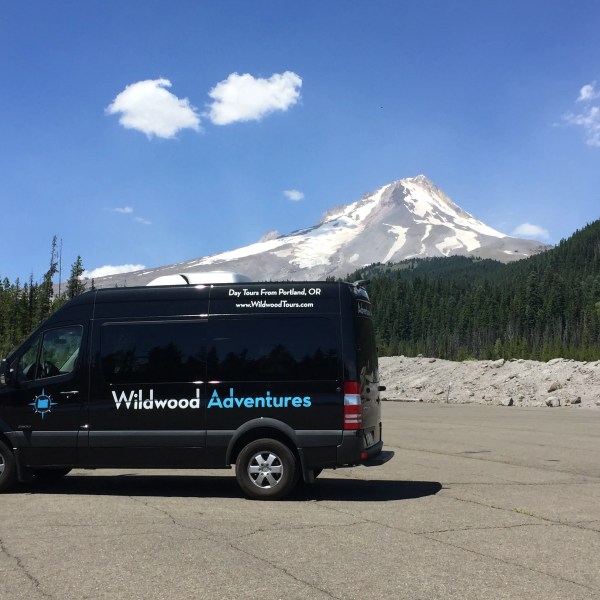 a car parked in front of a mountain